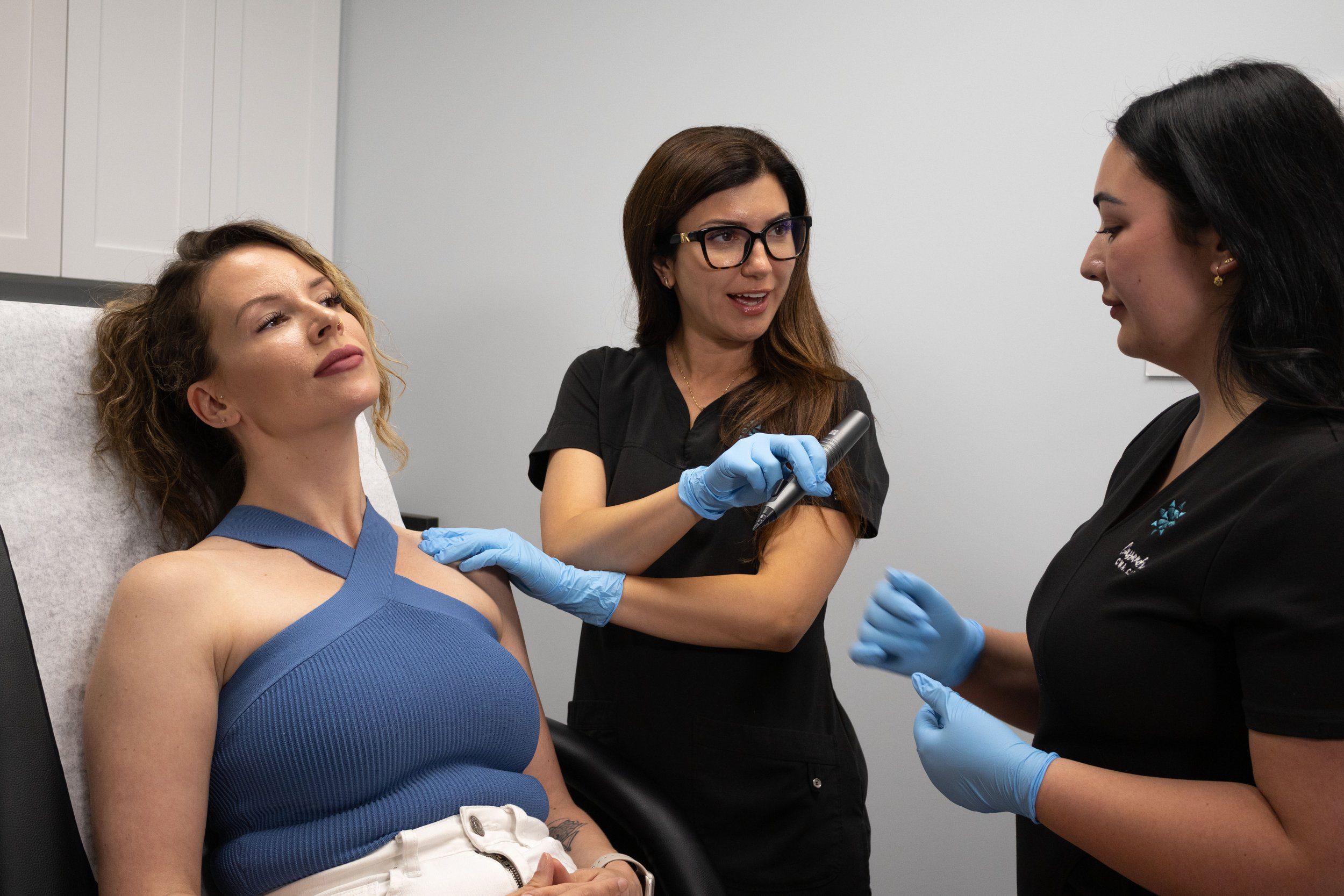 Alicia Yap training a medical aesthetics student in her clinic.