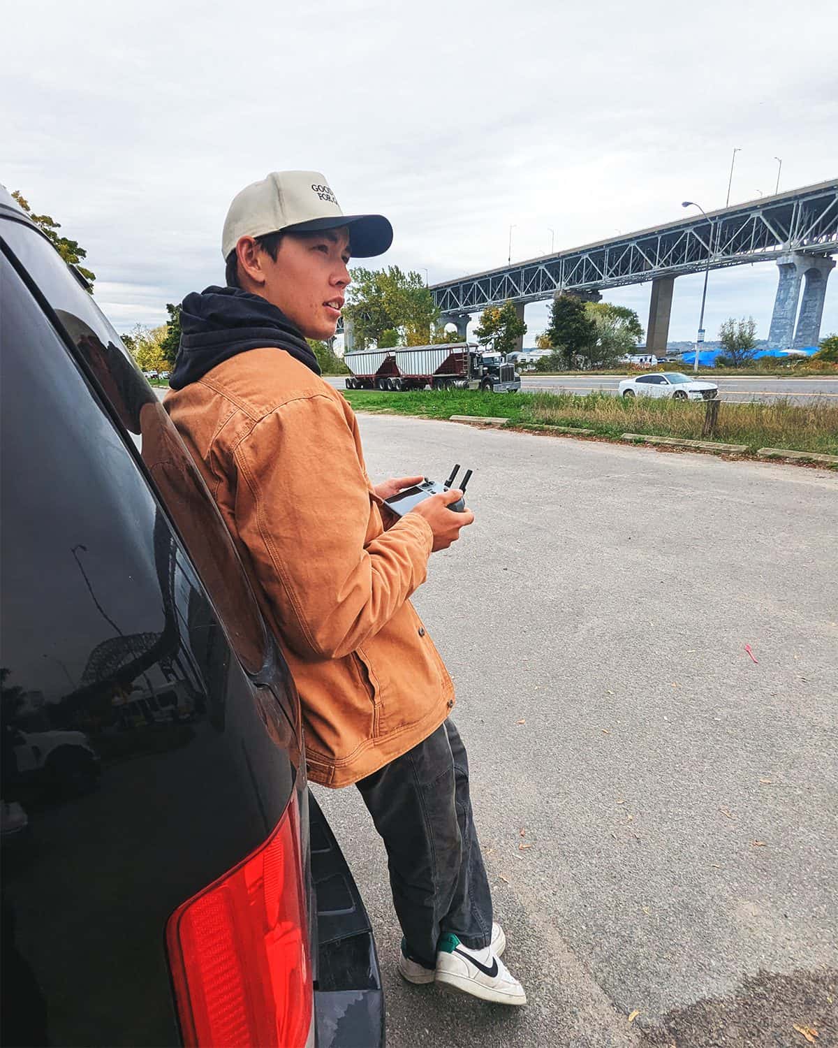 Ewen Fraser of FMC Media pilots a drone near the Skyway Bridge in Hamilton, Ontario.