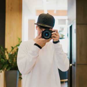 A mirror selfie of Geoffrey Faber using a Sony camera.
